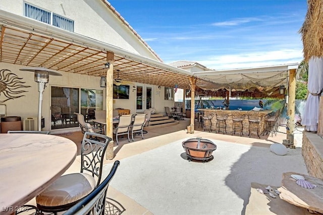 view of patio featuring a fire pit and outdoor dining space