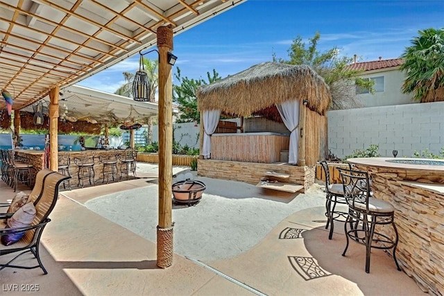 view of patio / terrace with an outdoor fire pit