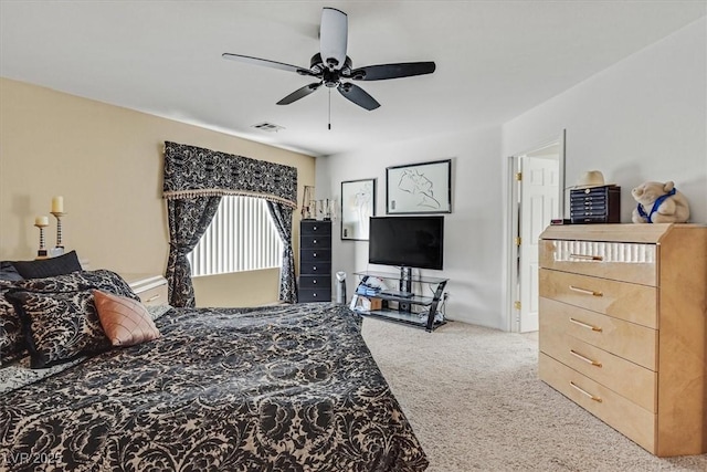 carpeted bedroom with a ceiling fan