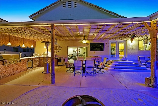 view of patio with a grill, area for grilling, a pergola, and outdoor dining area