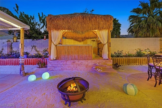 view of patio / terrace featuring a fire pit and a fenced backyard