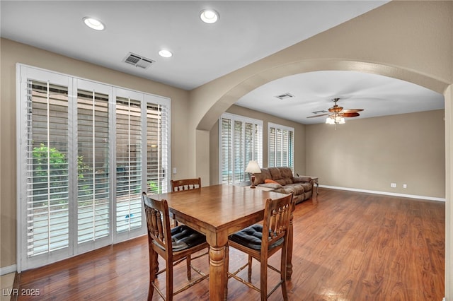 9893 Santa Ponsa Ct, Las Vegas, NV 89178 - dining area with a ceiling fan, arched walkways, baseboards, wood finished floors, and recessed lighting