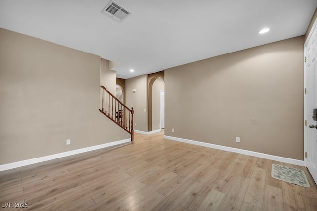 9893 Santa Ponsa Ct, Las Vegas, NV 89178 - foyer entrance featuring arched walkways, baseboards, light wood finished floors, recessed lighting, and stairway