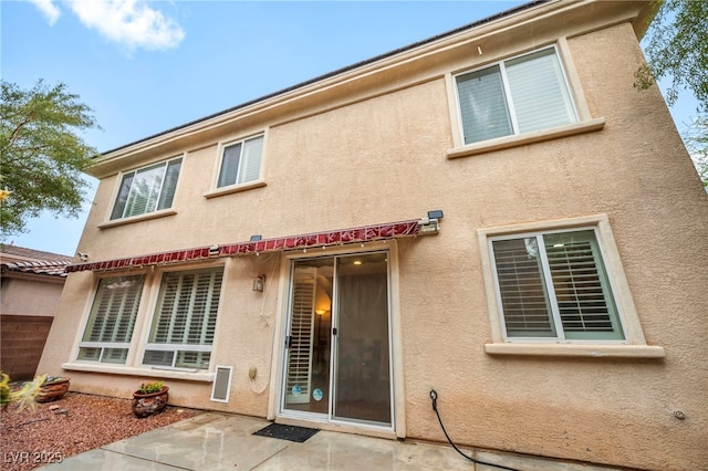 9893 Santa Ponsa Ct, Las Vegas, NV 89178 - back of property featuring stucco siding and a patio area