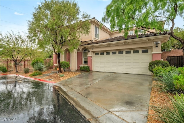 9893 Santa Ponsa Ct, Las Vegas, NV 89178 - view of front of house with stucco siding, fence, driveway, and an attached garage