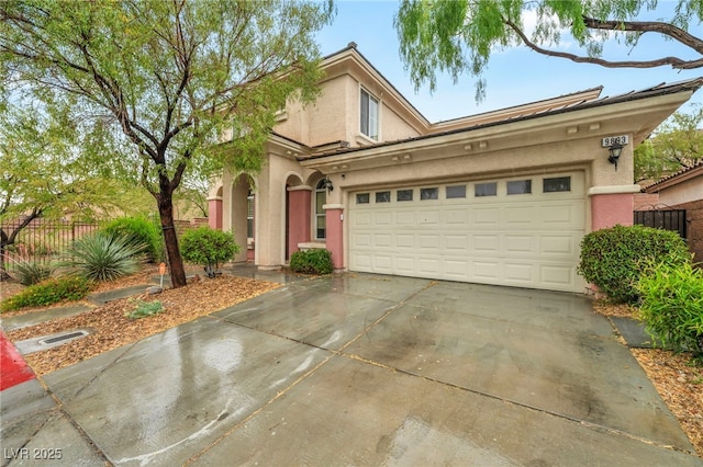 9893 Santa Ponsa Ct, Las Vegas, NV 89178 - traditional-style house featuring stucco siding, driveway, an attached garage, and fence