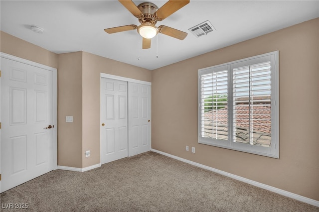 9893 Santa Ponsa Ct, Las Vegas, NV 89178 - unfurnished bedroom with carpet floors, baseboards, a closet, and a ceiling fan