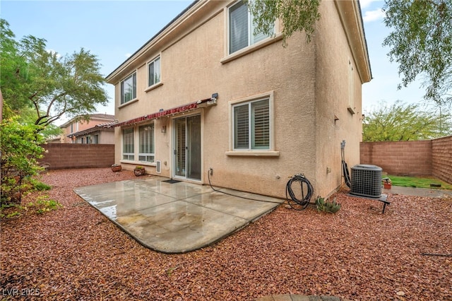 9893 Santa Ponsa Ct, Las Vegas, NV 89178 - rear view of house featuring central AC unit, stucco siding, and a fenced backyard