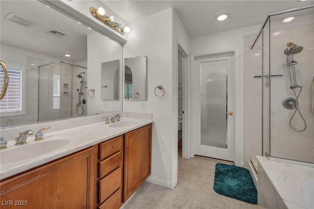 9893 Santa Ponsa Ct, Las Vegas, NV 89178 - full bathroom with a stall shower, double vanity, recessed lighting, and tile patterned flooring