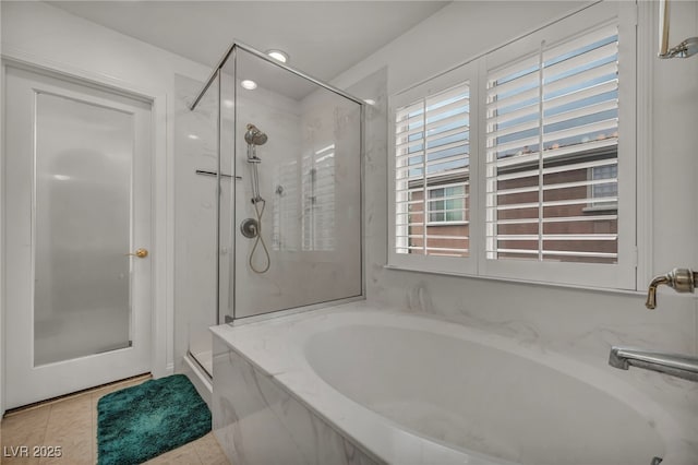 9893 Santa Ponsa Ct, Las Vegas, NV 89178 - bathroom with a marble finish shower, a bath, tile patterned floors, and recessed lighting