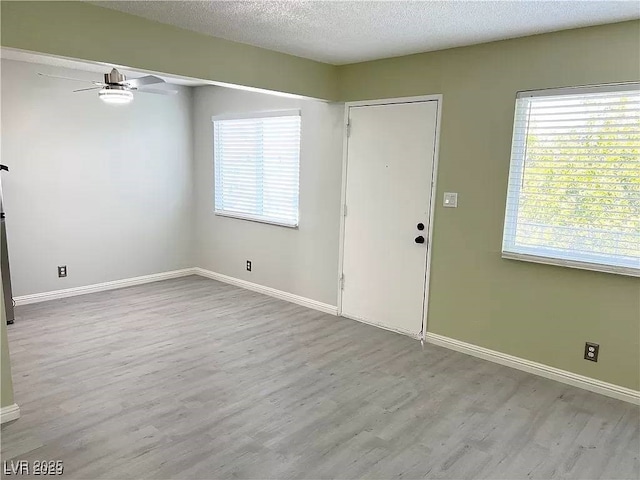 212 Orland St Unit 22, Las Vegas, NV 89107 - entryway featuring a ceiling fan, wood finished floors, healthy amount of natural light, baseboards, and a textured ceiling