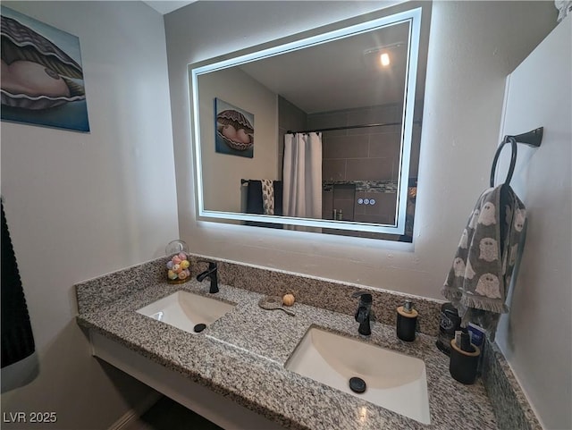 212 Orland St Unit 22, Las Vegas, NV 89107 - bathroom featuring double vanity and a shower with curtain