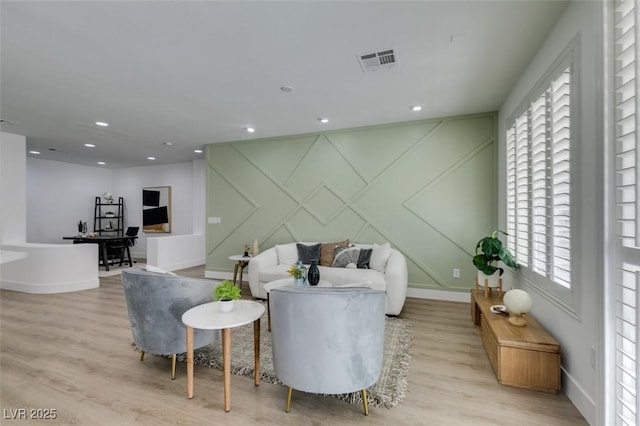 10389 Felice Ave, Las Vegas, NV 89135 - living area featuring a decorative wall, light wood-style floors, baseboards, plenty of natural light, and recessed lighting