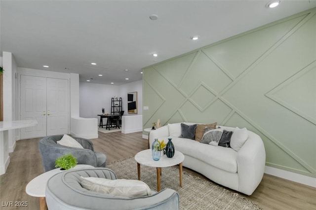 10389 Felice Ave, Las Vegas, NV 89135 - living area with light wood-style flooring, recessed lighting, a decorative wall, and baseboards