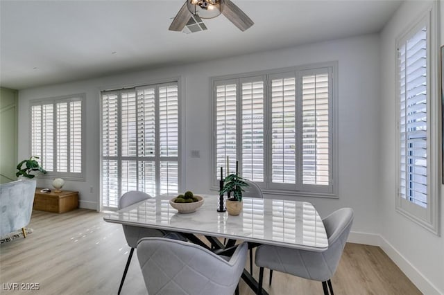 10389 Felice Ave, Las Vegas, NV 89135 - dining room with light wood finished floors, baseboards, and a ceiling fan