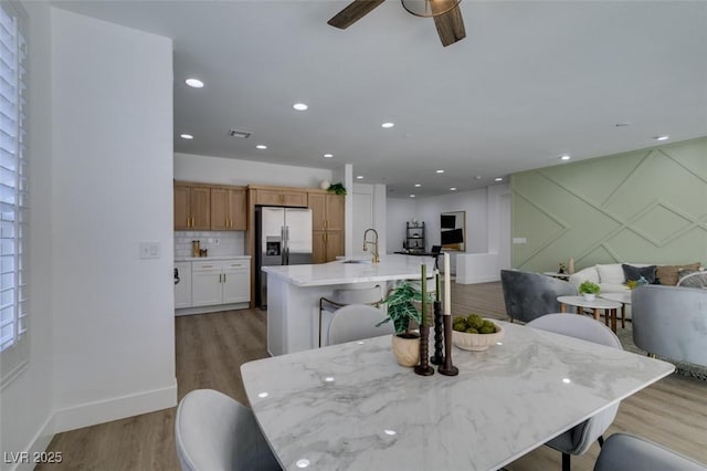 10389 Felice Ave, Las Vegas, NV 89135 - dining room featuring light wood finished floors, a ceiling fan, baseboards, and recessed lighting