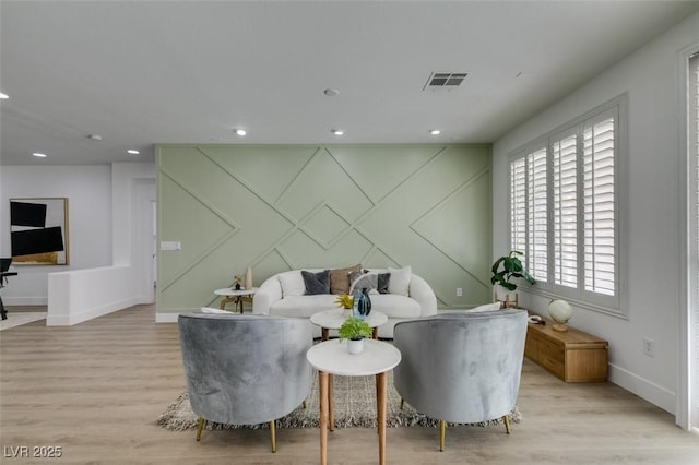 10389 Felice Ave, Las Vegas, NV 89135 - living room with light wood-style floors, baseboards, recessed lighting, and a decorative wall