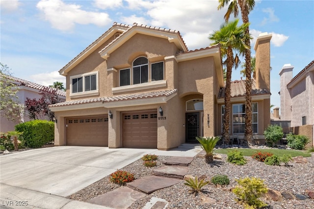 2113 Waterbury Ln, Las Vegas, NV 89134 - mediterranean / spanish house with a tile roof, stucco siding, a garage, and concrete driveway