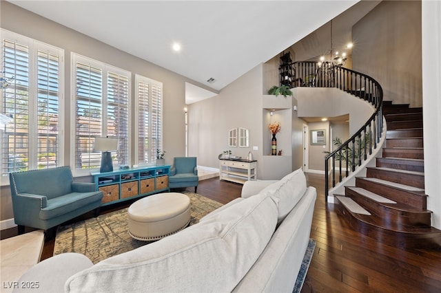 2113 Waterbury Ln, Las Vegas, NV 89134 - living area with hardwood / wood-style flooring, healthy amount of natural light, a chandelier, stairs, and high vaulted ceiling
