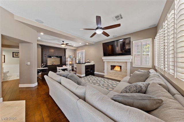 2113 Waterbury Ln, Las Vegas, NV 89134 - living room with ceiling fan, dark wood finished floors, healthy amount of natural light, a fireplace with flush hearth, and recessed lighting