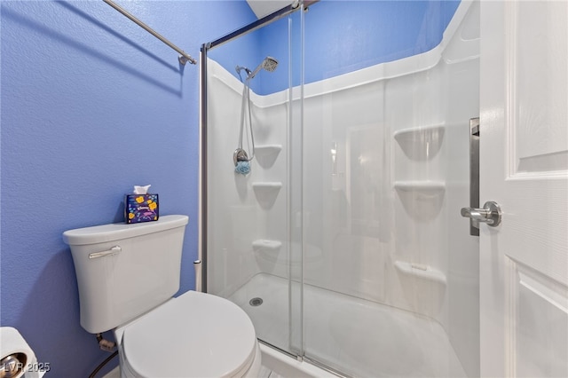2113 Waterbury Ln, Las Vegas, NV 89134 - full bathroom with a textured wall, a shower stall, and toilet