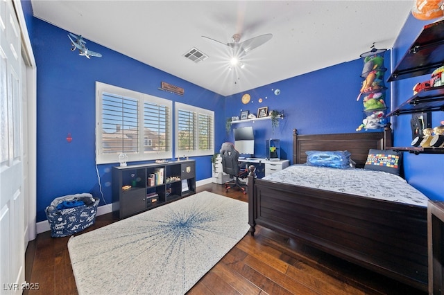 2113 Waterbury Ln, Las Vegas, NV 89134 - bedroom with wood finished floors, a desk, baseboards, and a ceiling fan