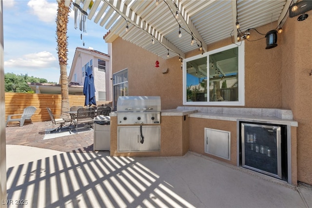 2113 Waterbury Ln, Las Vegas, NV 89134 - view of patio / terrace featuring exterior kitchen, a grill, wine cooler, fence, and a pergola