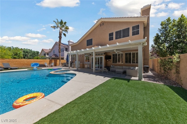 2113 Waterbury Ln, Las Vegas, NV 89134 - rear view of house with a ceiling fan, a patio area, stucco siding, a pool with connected hot tub, and a chimney