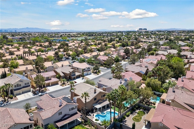 2113 Waterbury Ln, Las Vegas, NV 89134 - aerial view of residential area with a pool area and a mountain backdrop