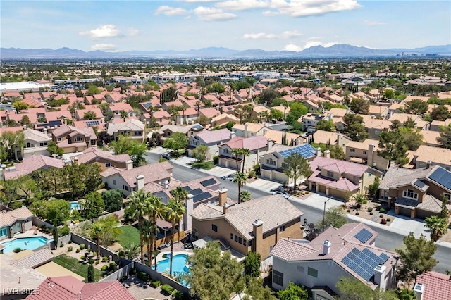 2113 Waterbury Ln, Las Vegas, NV 89134 - aerial perspective of suburban area featuring a pool area and a mountain backdrop
