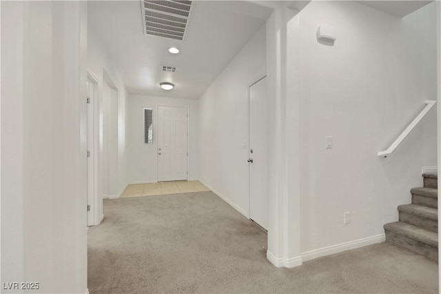 hallway featuring carpet floors, baseboards, stairway, and recessed lighting