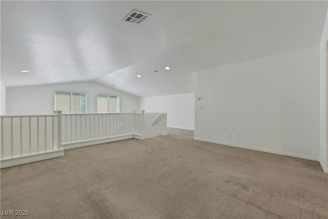 bonus room with vaulted ceiling, light carpet, recessed lighting, and baseboards