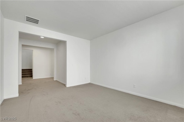 carpeted spare room with baseboards and recessed lighting