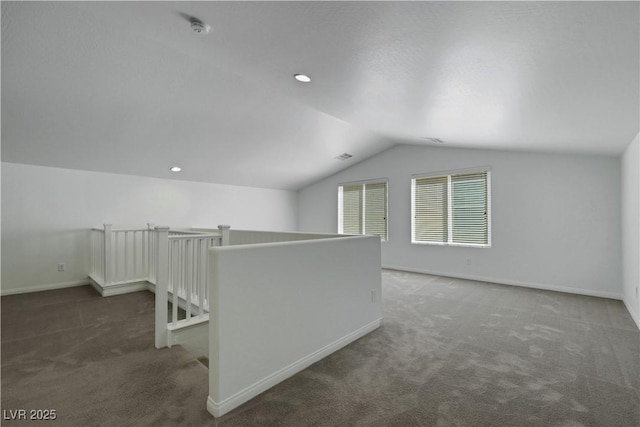 bonus room featuring carpet flooring, lofted ceiling, and baseboards