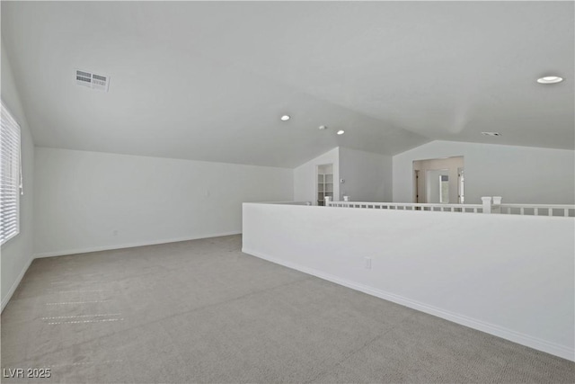 additional living space featuring vaulted ceiling, carpet floors, recessed lighting, and baseboards