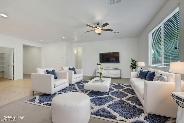 living room featuring a ceiling fan, recessed lighting, and light tile patterned flooring