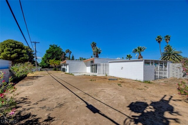 back of house with fence