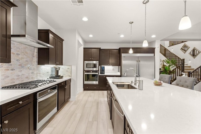 4505 Amazing View St, Las Vegas, NV 89129 - kitchen featuring built in appliances, wall chimney range hood, a sink, light countertops, and dark brown cabinetry