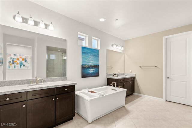 4505 Amazing View St, Las Vegas, NV 89129 - full bathroom with a shower stall, two vanities, baseboards, tile patterned floors, and a bathtub