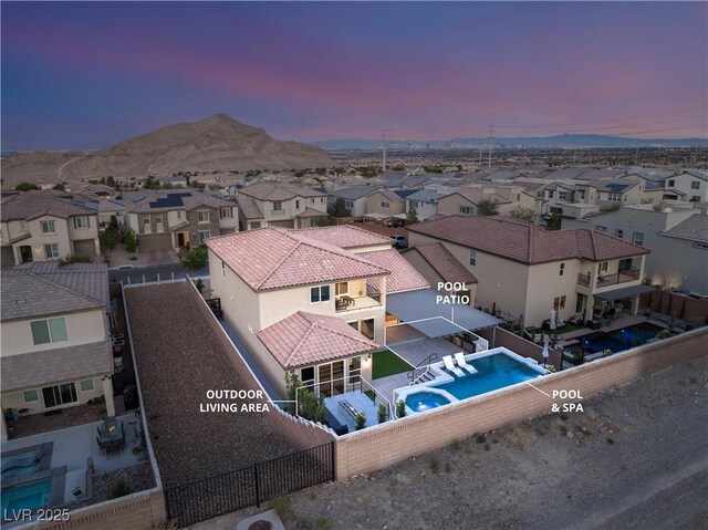 4505 Amazing View St, Las Vegas, NV 89129 - aerial view at dusk of a residential view, a mountain view, and view of pool area