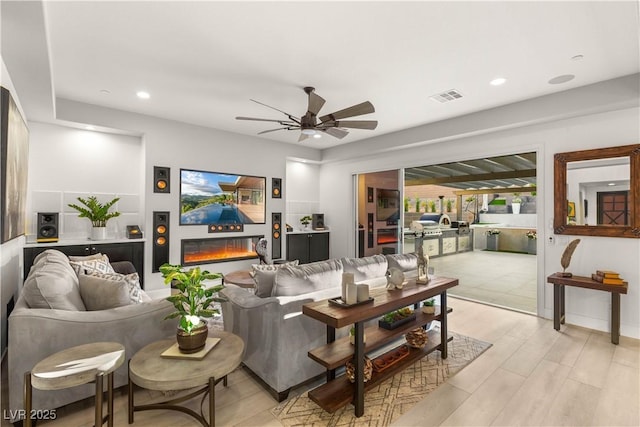 4505 Amazing View St, Las Vegas, NV 89129 - living area with a ceiling fan, recessed lighting, and a glass covered fireplace