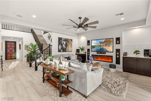 4505 Amazing View St, Las Vegas, NV 89129 - living area featuring a ceiling fan, light wood-type flooring, recessed lighting, and stairs