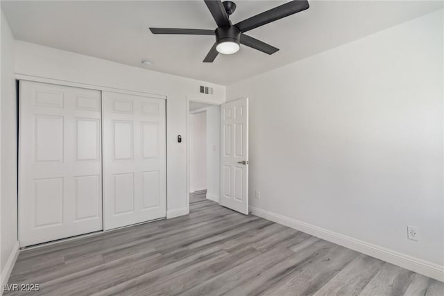 326 Fuente Dr, Henderson, NV 89014 - unfurnished bedroom featuring baseboards, wood finished floors, a closet, and a ceiling fan