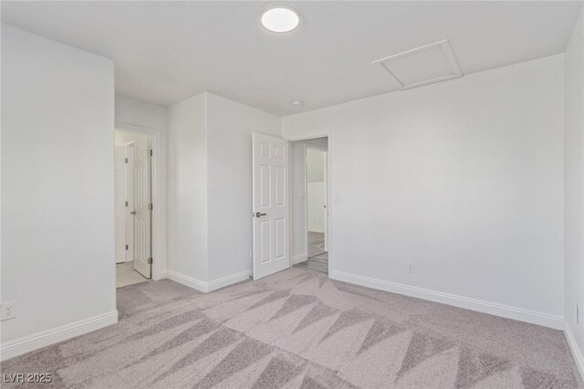 326 Fuente Dr, Henderson, NV 89014 - unfurnished room featuring light carpet, attic access, and baseboards
