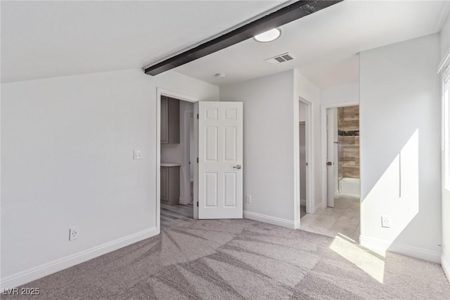 326 Fuente Dr, Henderson, NV 89014 - unfurnished bedroom with carpet flooring, beam ceiling, baseboards, and ensuite bathroom