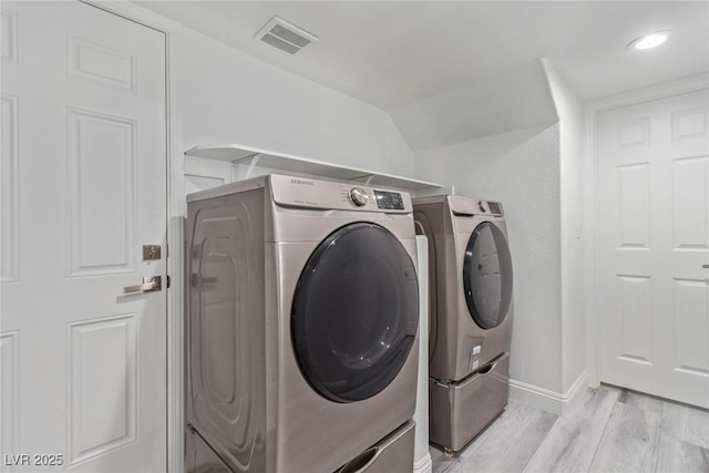 326 Fuente Dr, Henderson, NV 89014 - laundry area with washing machine and dryer, light wood-style floors, and baseboards