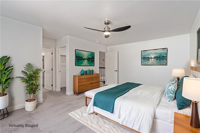 326 Fuente Dr, Henderson, NV 89014 - bedroom featuring light carpet, baseboards, and a ceiling fan