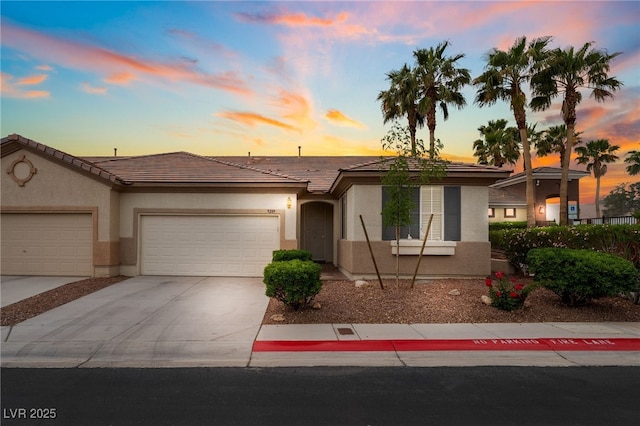 9289 Mandeville Bay Ave, Las Vegas, NV 89148 - ranch-style house with a garage, stucco siding, concrete driveway, and a tile roof