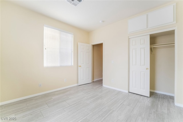 9289 Mandeville Bay Ave, Las Vegas, NV 89148 - unfurnished bedroom with light wood-style floors, a closet, and baseboards