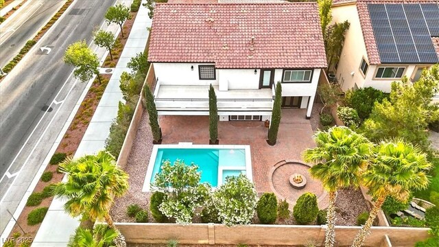 view of subject property featuring a pool area